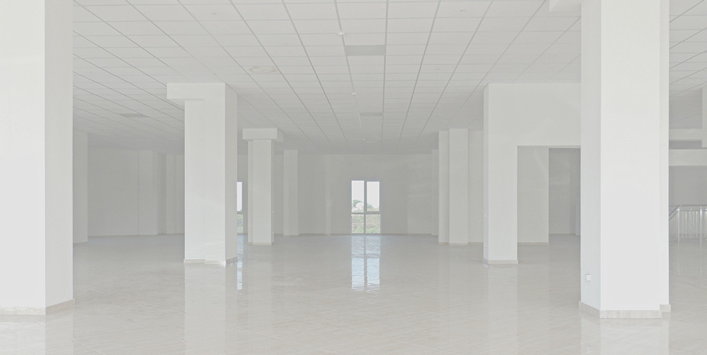 A very large, all white, empty room